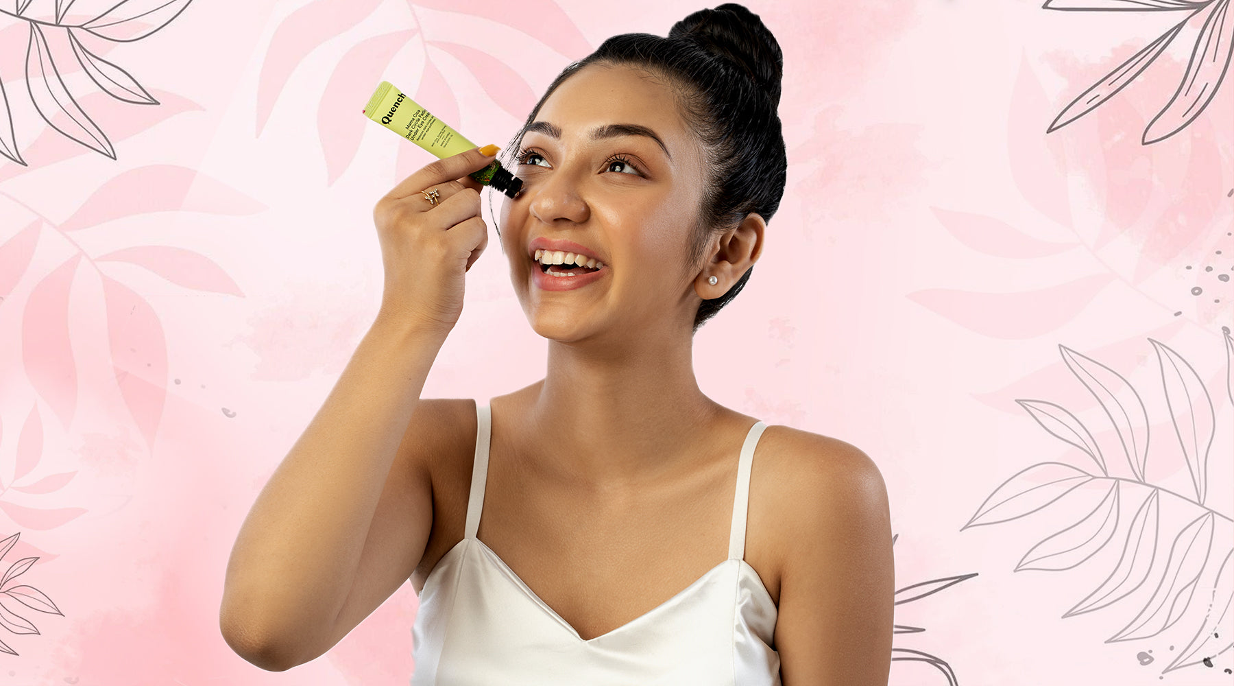 Indian woman holding the Quench Mama Cica Dark Circle Fading Under Eye Cream